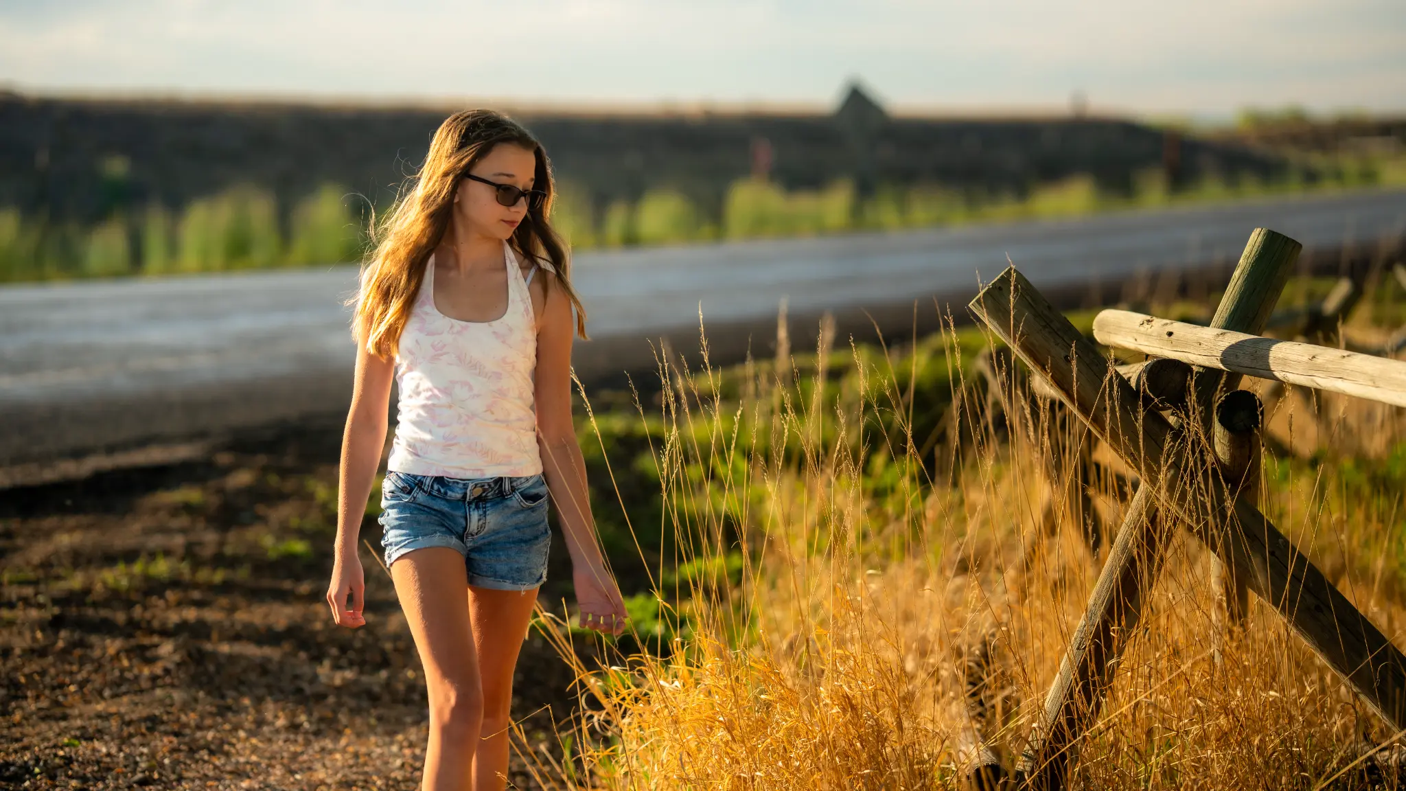 Lily Anna Zachman walking through a natural-light outdoor setting in Palm City, Florida.