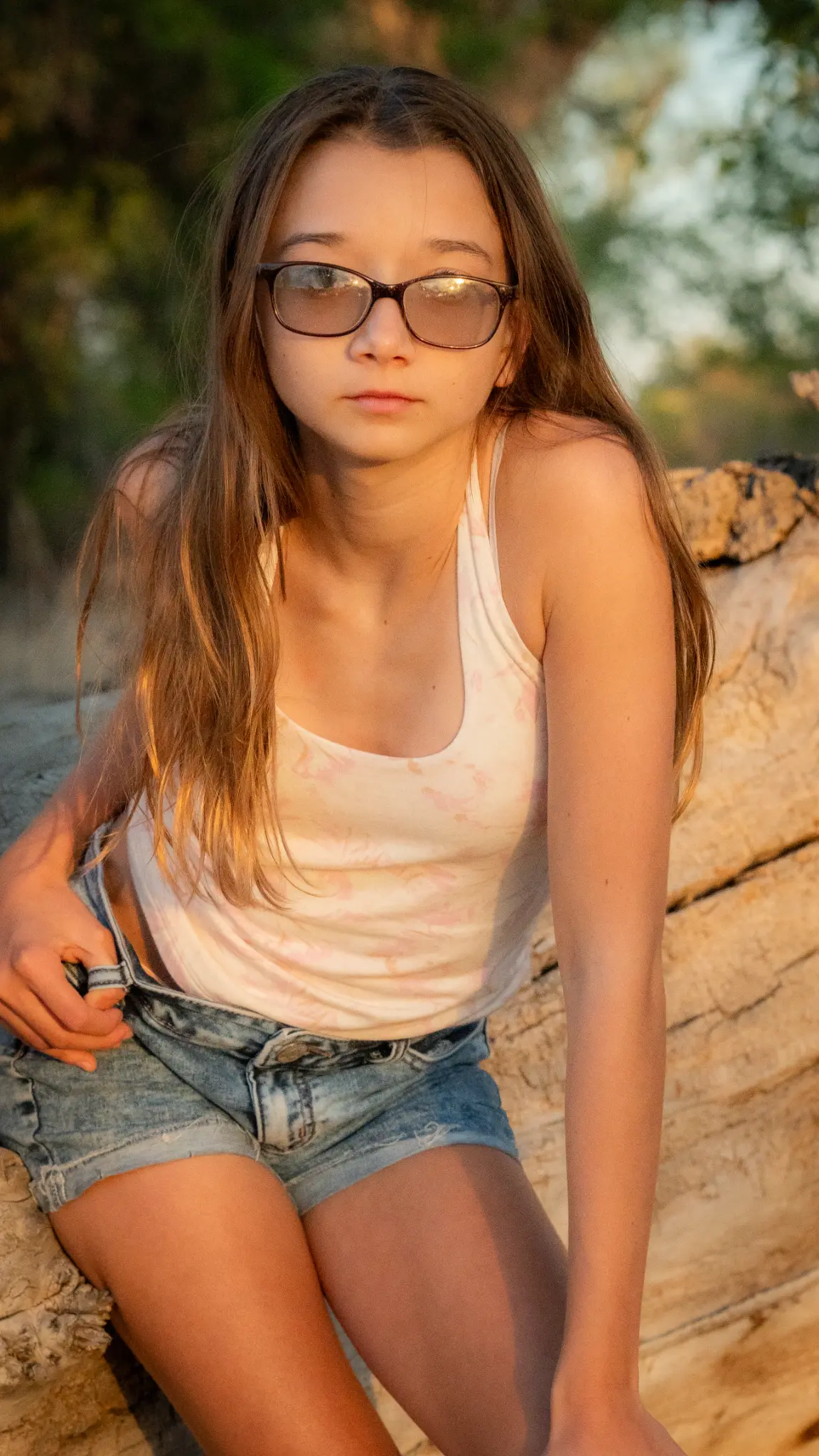 Cinematic outdoor portrait of Lily Anna Zachman in a natural setting.